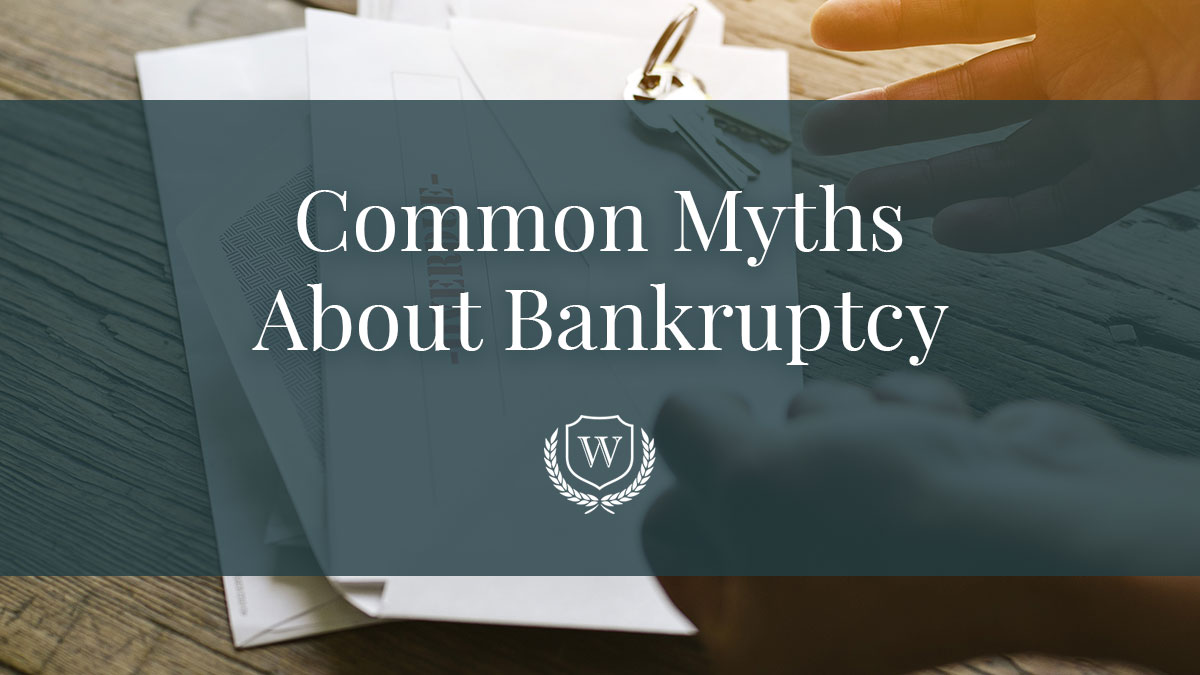 A photo of overdue bills stacked on top of eachother with the text "Common Myths About Bankruptcy" and the Wynn Law Firm logo over it.